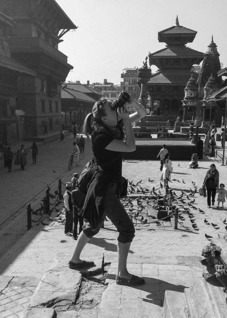 woman in Patan taking photo